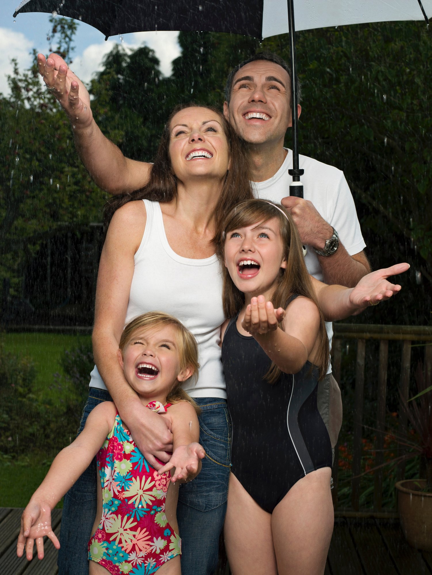 a-family-under-an-umbrella-in-the-rain-2024-11-03-02-46-50-utc